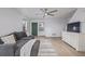 Bright living room features hardwood floors, a comfortable gray sofa, and neutral decor at 649 Mockingbird St, Brighton, CO 80601