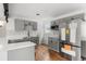 Remodeled kitchen featuring new appliances, gray cabinets, sleek countertops, and new hardwood flooring at 4701 E Jewell Ave, Denver, CO 80222