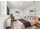 Cozy main bedroom featuring plush carpets, ambient lighting, closet, and a comfortable queen-sized bed at 4701 E Jewell Ave, Denver, CO 80222