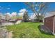 A spacious backyard with lush green grass and privacy fence at 5510 Troy St, Denver, CO 80239