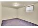 The basement bedroom is carpeted and features a single window for natural light at 5510 Troy St, Denver, CO 80239