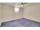 The basement bedroom is carpeted and features a single window for natural light at 5510 Troy St, Denver, CO 80239