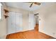 Well-lit bedroom features hardwood floors, a closet, and ample space, creating a comfortable and inviting retreat at 5510 Troy St, Denver, CO 80239