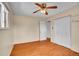 Comfortable bedroom with hardwood floors, ample closet space, and natural light, offering a peaceful retreat at 5510 Troy St, Denver, CO 80239