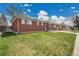 Brick home with green front lawn at 5510 Troy St, Denver, CO 80239