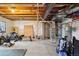 Unfinished basement featuring utility components, workout equipment and lots of potential at 2042 Shadow Creek Dr, Castle Rock, CO 80104