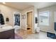 Well-lit bathroom with double vanity, closet, and enclosed toilet for added convenience at 2042 Shadow Creek Dr, Castle Rock, CO 80104