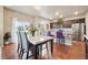 Bright dining area with a marble-top table that seamlessly connects to the kitchen at 2042 Shadow Creek Dr, Castle Rock, CO 80104