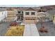 Charming two-story home with a well-manicured front yard and a blend of stone and siding accents at 2042 Shadow Creek Dr, Castle Rock, CO 80104
