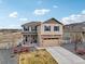Charming two-story home with stone accents and a well-manicured front yard, situated with nice curb appeal at 2042 Shadow Creek Dr, Castle Rock, CO 80104