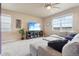 Cozy living room showcasing a plush sectional sofa and large windows with scenic views at 2042 Shadow Creek Dr, Castle Rock, CO 80104