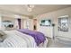 Spacious main bedroom with a large bed, ceiling fan, and ample closet space at 2042 Shadow Creek Dr, Castle Rock, CO 80104