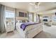 Bright main bedroom with plenty of natural light, ceiling fan and decorative crystal light fixture at 2042 Shadow Creek Dr, Castle Rock, CO 80104