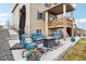 Inviting patio area with comfortable seating and a fire pit, perfect for relaxing outdoors at 2042 Shadow Creek Dr, Castle Rock, CO 80104
