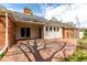 Enjoy outdoor living on this spacious brick patio with access to the home through sliding glass doors at 3756 S Forest Way, Denver, CO 80237