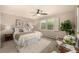Cozy bedroom featuring a ceiling fan, white shutters, and a neutral color palette at 3756 S Forest Way, Denver, CO 80237