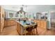 Eat-in kitchen features an island with barstool seating, and lots of natural light at 3756 S Forest Way, Denver, CO 80237