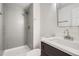 Modern bathroom with gray tile shower and vanity at 15934 E Columbia Pl, Aurora, CO 80013