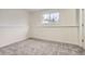 Well-lit bedroom featuring gray carpet and a window at 15934 E Columbia Pl, Aurora, CO 80013