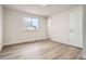 Well-lit bedroom featuring new flooring and neutral decor at 15934 E Columbia Pl, Aurora, CO 80013