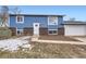 Charming blue house with brick accents and a spacious yard at 15934 E Columbia Pl, Aurora, CO 80013