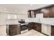 Modern kitchen with stainless steel appliances and white backsplash at 15934 E Columbia Pl, Aurora, CO 80013