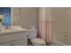 Bathroom with shower, tub, white tile and white vanity, and colorful mermaid decor at 14445 Hop Clover Trl, Parker, CO 80134