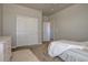 Cozy bedroom with closet and view of entryway at 14445 Hop Clover Trl, Parker, CO 80134