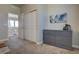 Hallway with gray dresser, leading to the upper landing and bedroom closets at 14445 Hop Clover Trl, Parker, CO 80134