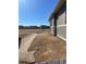 Spacious backyard showcasing an open field beyond the fence, offering serene views from this new construction at 16602 E 109Th Ave, Commerce City, CO 80022