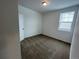 Bright bedroom with neutral carpeting and window at 16602 E 109Th Ave, Commerce City, CO 80022