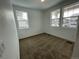 Spacious bedroom with neutral carpeting and large windows at 16602 E 109Th Ave, Commerce City, CO 80022