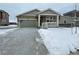 New construction home with attached garage and front porch at 16602 E 109Th Ave, Commerce City, CO 80022