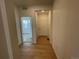 Light and airy hallway with hardwood floors and access to rooms at 16602 E 109Th Ave, Commerce City, CO 80022