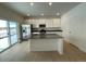 Modern kitchen with island, stainless steel appliances, and hardwood floors at 16602 E 109Th Ave, Commerce City, CO 80022