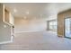 Finished basement showcasing a sliding glass door and stairs at 841 W 128Th Pl, Westminster, CO 80234