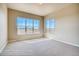 Bedroom with large windows offering ample natural light and carpet flooring at 841 W 128Th Pl, Westminster, CO 80234