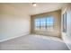 Spacious bedroom with large windows, carpet flooring, and neutral color palette at 841 W 128Th Pl, Westminster, CO 80234