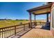 Covered deck with stone pillars and scenic views at 841 W 128Th Pl, Westminster, CO 80234