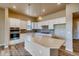 Modern kitchen with white cabinets, quartz countertops, and stainless steel appliances at 841 W 128Th Pl, Westminster, CO 80234