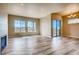 Open living room with hardwood floors and large windows at 841 W 128Th Pl, Westminster, CO 80234