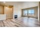 Living room featuring hardwood floors and a modern fireplace at 841 W 128Th Pl, Westminster, CO 80234