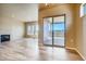 Bright living room with hardwood floors, fireplace, and sliding glass doors to patio at 841 W 128Th Pl, Westminster, CO 80234