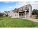 Well-manicured lawn with stone landscaping and a large, inviting patio at 21062 Hawthorne Ln, Parker, CO 80138