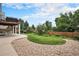 Backyard featuring a grassy lawn, stone landscaping, and a wooden fence at 21062 Hawthorne Ln, Parker, CO 80138