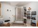 Bathroom featuring a shower, toilet, and built-in shelving with decorations at 21062 Hawthorne Ln, Parker, CO 80138
