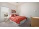 Bright bedroom featuring a comfortable bed, side table, and functional desk setup at 21062 Hawthorne Ln, Parker, CO 80138