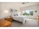 Bright bedroom with vaulted ceilings, large windows with views of the landscape, and a ceiling fan at 21062 Hawthorne Ln, Parker, CO 80138