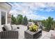 Outdoor deck with comfortable wicker furniture and scenic views at 21062 Hawthorne Ln, Parker, CO 80138