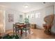 Bright dining area with table, chairs, and unique wicker chair at 21062 Hawthorne Ln, Parker, CO 80138